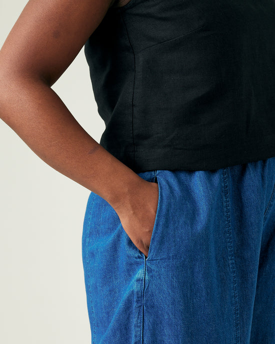 model wears mid wash chambray mabel trousers