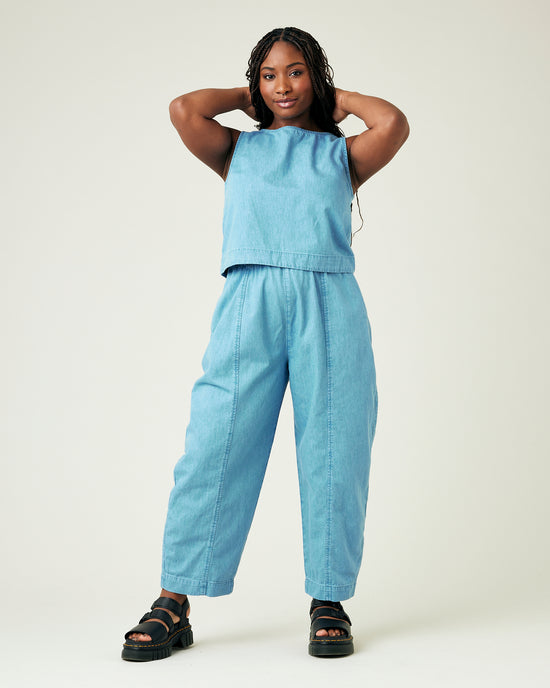 model wears light wash chambray mabel trousers