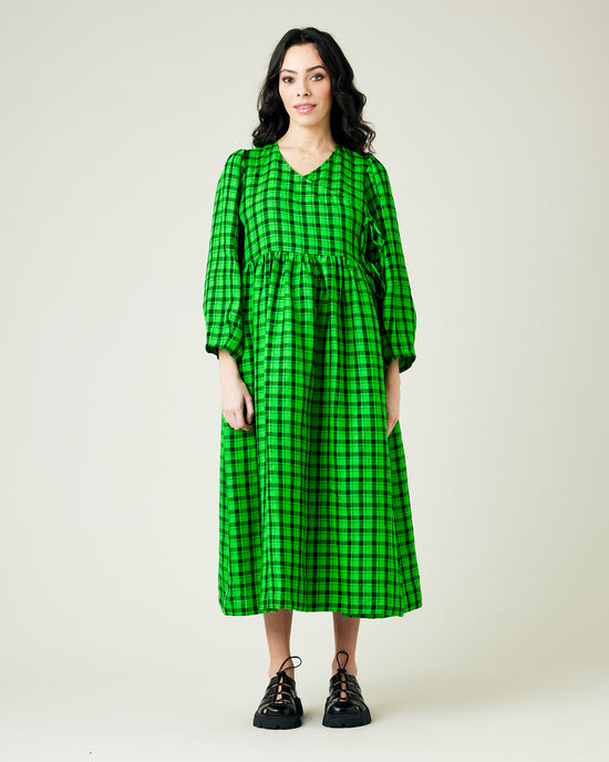 model wears green and black check linen isabel dress