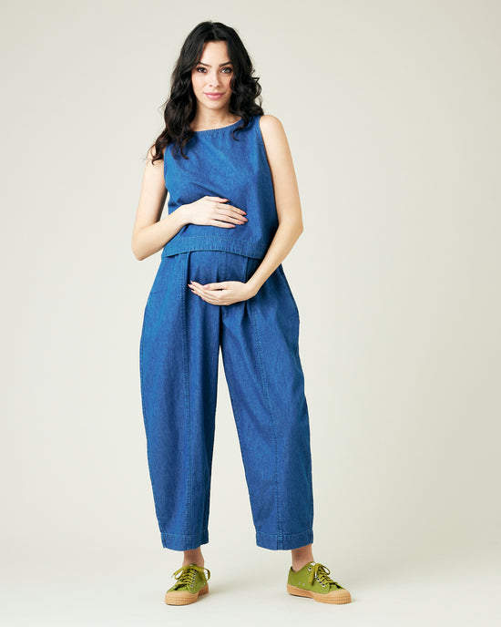 pregnant model wears mid wash chambray mabel trousers