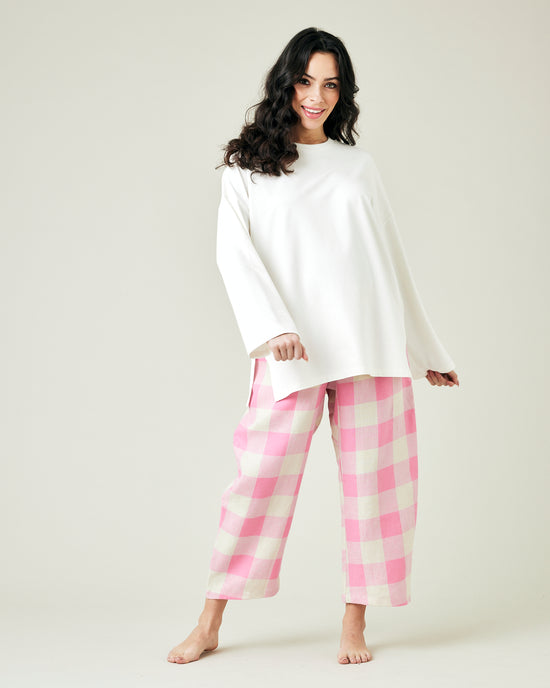 pregnant model wears pinks and ecru mega check ultimate pj linen trousers