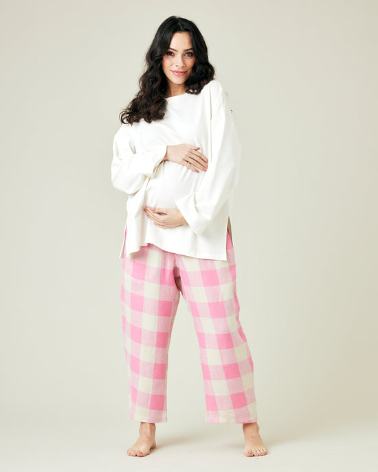 pregnant model wears pinks and ecru mega check ultimate pj linen trousers