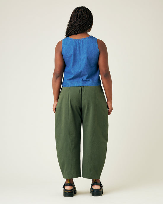 model wears khaki seersucker mabel trousers