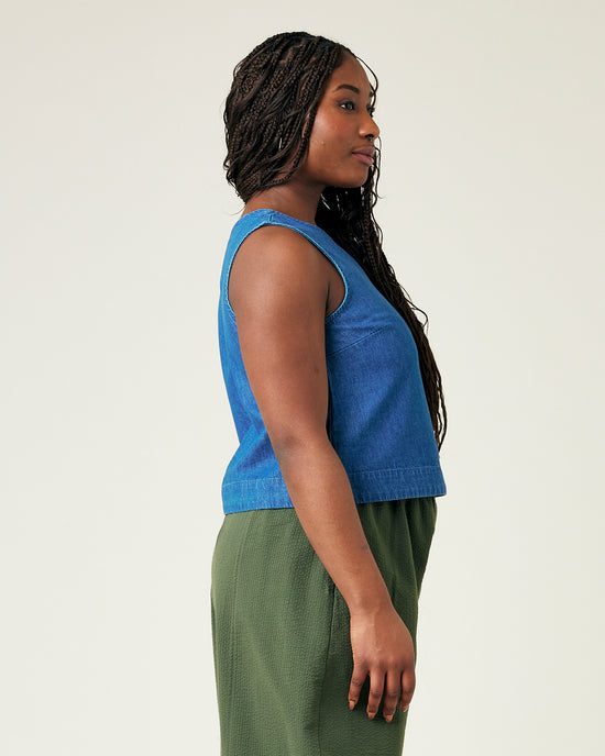 model wears mid wash chambray esme top