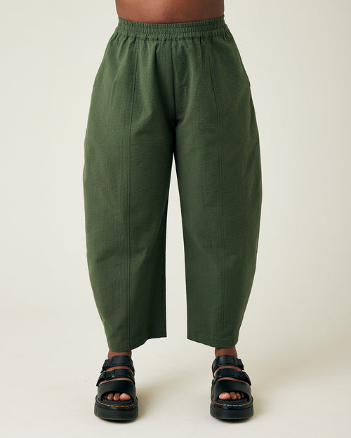 model wears khaki seersucker mabel trousers