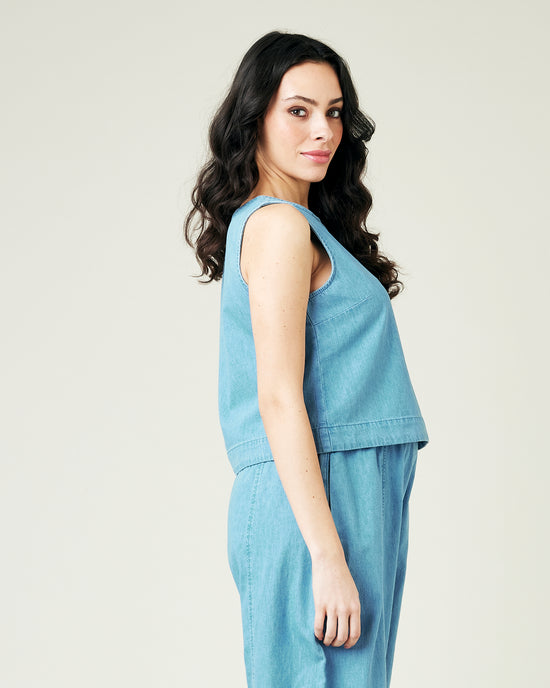 pregnant model wears light wash chambray esme top