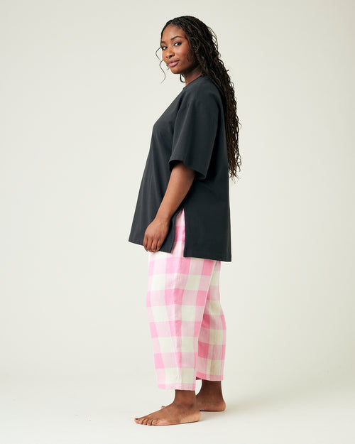 model wears pinks and ecru mega check ultimate pj linen trousers