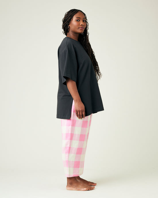 model wears pinks and ecru mega check ultimate pj linen trousers