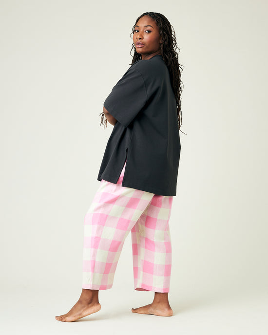 model wears pinks and ecru mega check ultimate pj linen trousers