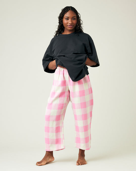 model wears pinks and ecru mega check ultimate pj linen trousers