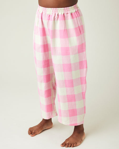 model wears pinks and ecru mega check ultimate pj linen trousers