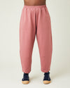 model wears dusty pink huxley jersey trousers front