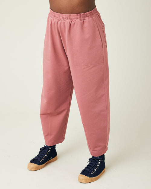 model wears dusty pink huxley jersey trousers left