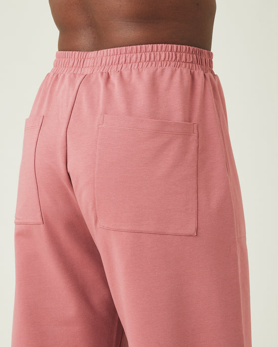 model wears dusty pink huxley jersey trousers