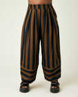 model wears rust stripe bobbi trousers front