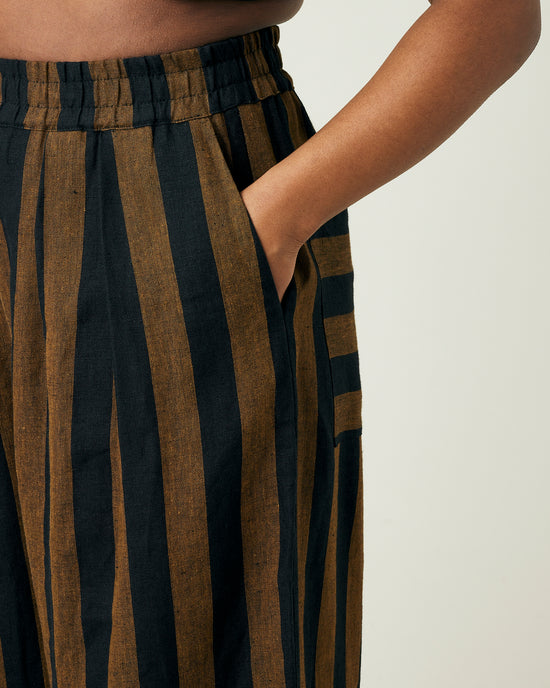 model wears rust stripe bobbi trousers