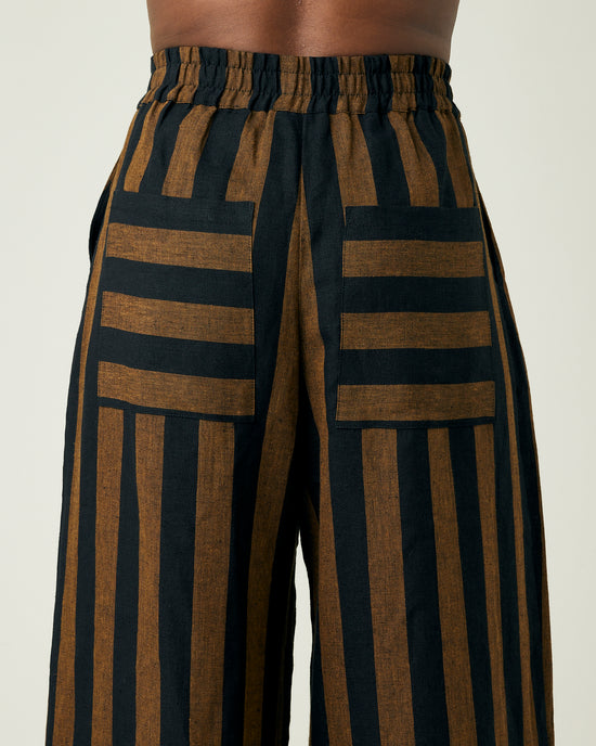 model wears rust stripe bobbi trousers