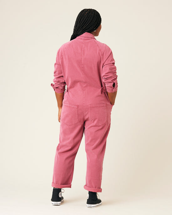 model wears pink hallie jumpsuit