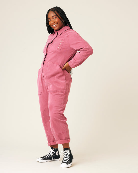 model wears pink hallie jumpsuit