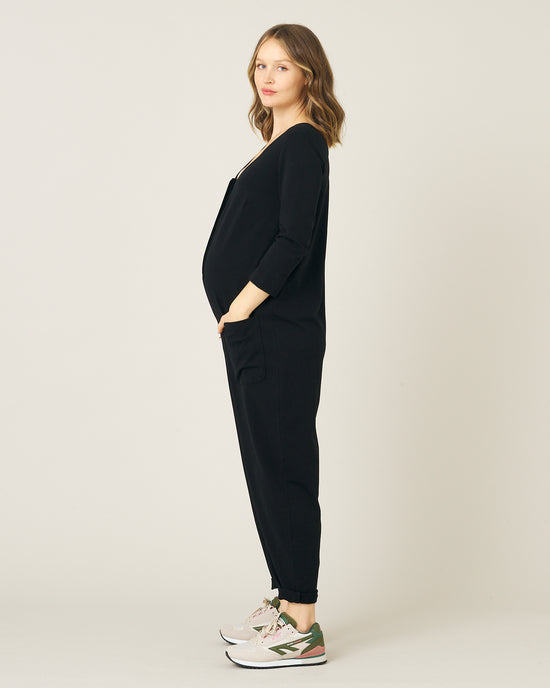 pregnant model wears black margot jumpsuit