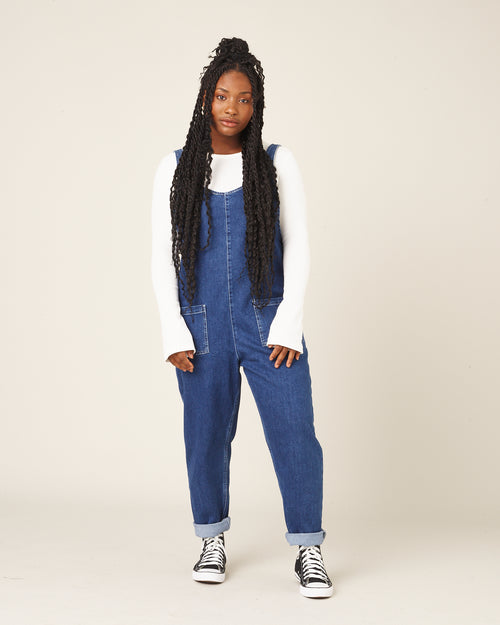 model wears mid blue denim lola jumpsuit