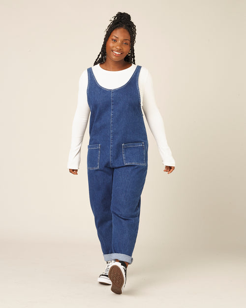 model wears mid blue denim lola jumpsuit