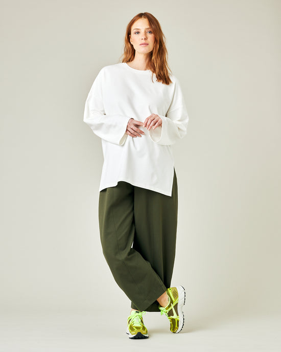 pregnant model wears olive jersey mabel trousers