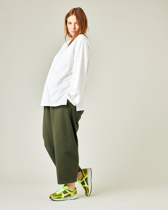 pregnant model wears olive jersey mabel trousers