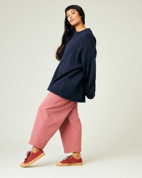 model wears dusty pink fleece jersey trousers