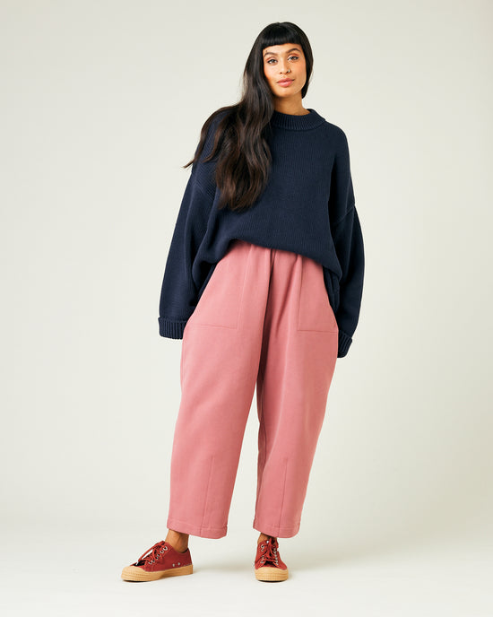 model wears dusty pink fleece jersey trousers