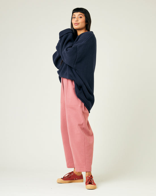 model wears dusty pink fleece jersey trousers