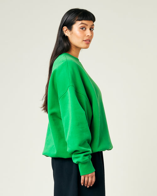 model wears juniper green jersey riley jumper