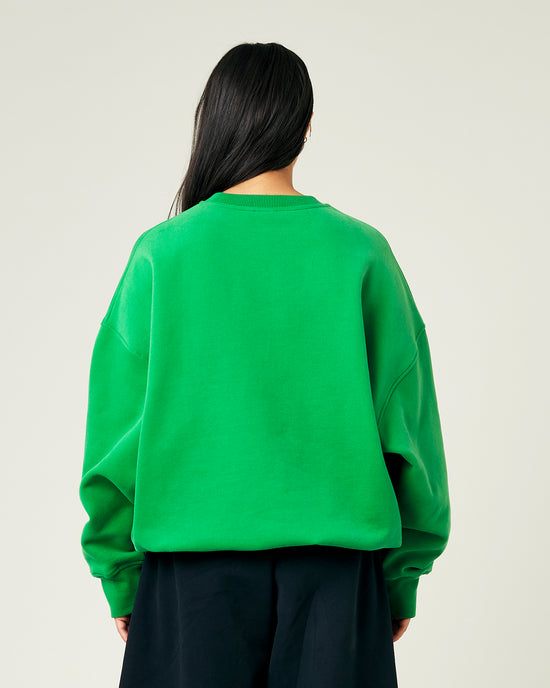 model wears juniper green jersey riley jumper