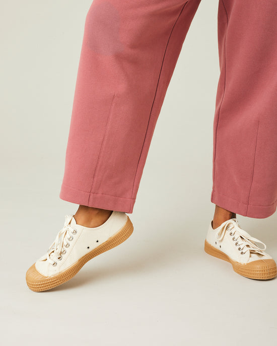 model wears dusty pink fleece jersey trousers