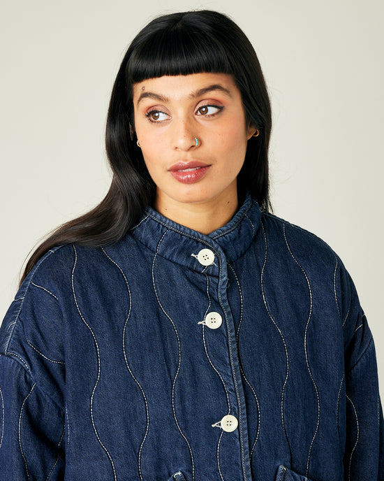 model wears dark wash denim rue jacket