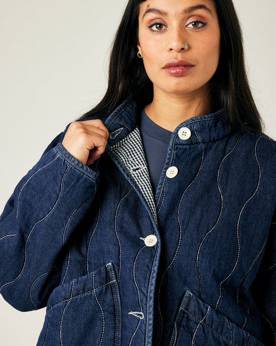 model wears dark wash denim rue jacket