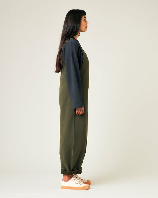 model wears olive jersey clover jumpsuit