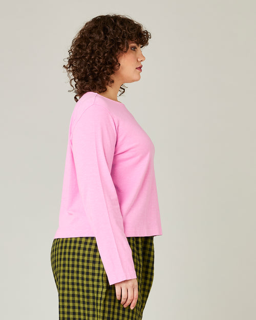 model wears bubblegum pink boat neck top