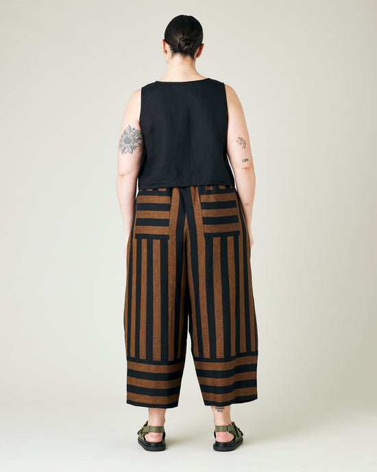 model wears rust stripe bobbi trousers