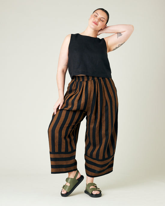 model wears rust stripe bobbi trousers