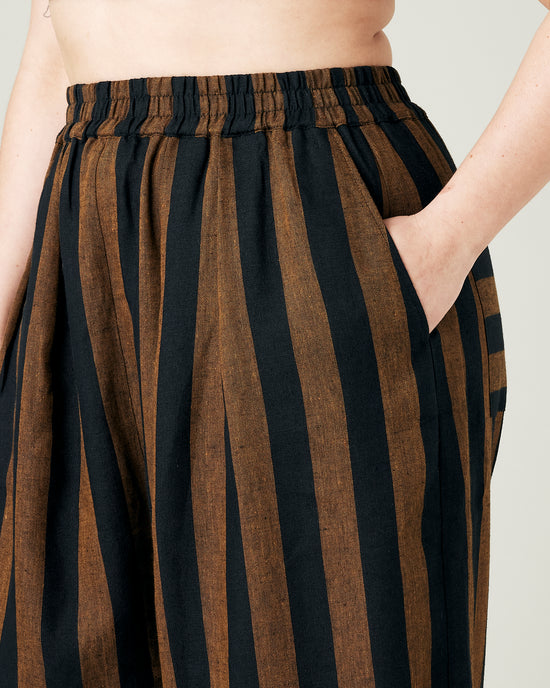 model wears rust stripe bobbi trousers