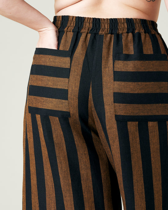 model wears rust stripe bobbi trousers