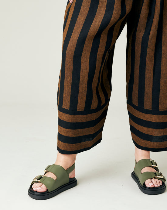 model wears rust stripe bobbi trousers