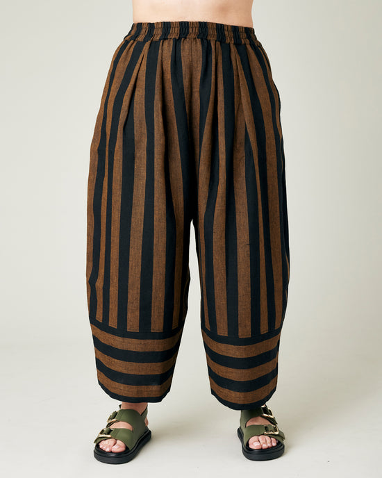 model wears rust stripe bobbi trousers