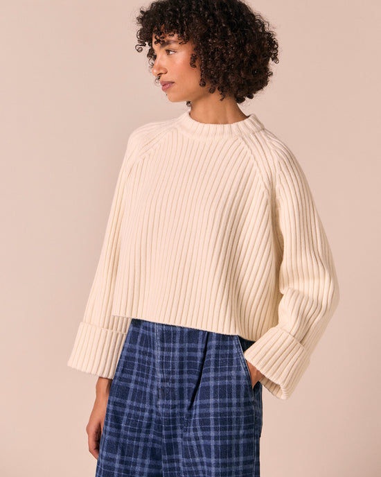 model wears cadi bone knitted jumper