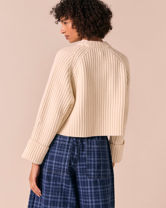 model wears cadi bone knitted jumper