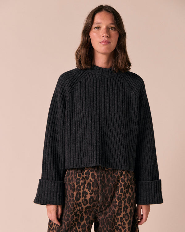 model wears cadi charcoal knitted jumper