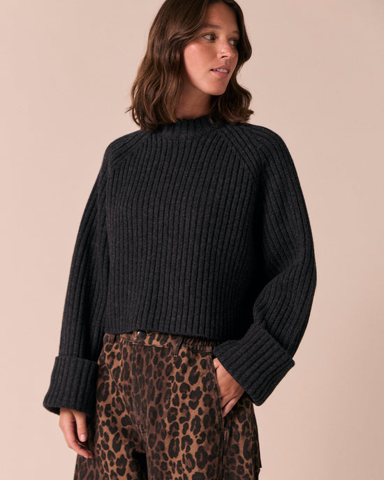 model wears cadi charcoal knitted jumper
