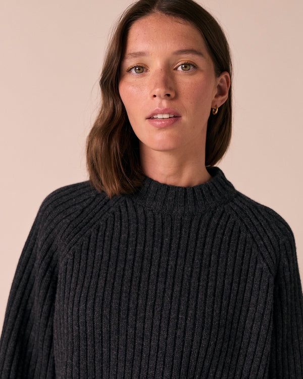 model wears cadi charcoal knitted jumper