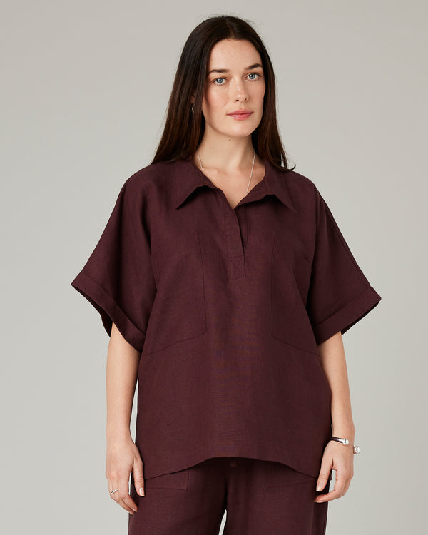model wears burgundy linen cara shirt
